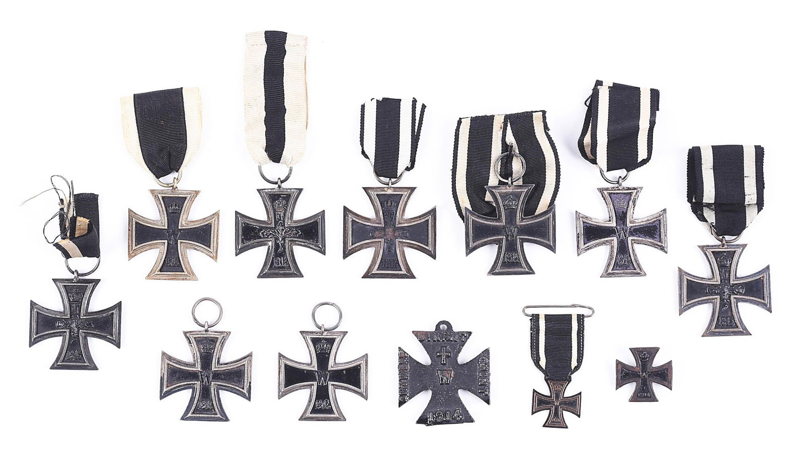 LOT OF 12: IMPERIAL GERMAN 1914 2ND CLASS IRON CROSSES.: Lot includes 9 Imperial German World War I 2nd class Iron Crosses, a mini 1914 EKI, a mini 1870 EKII, and a WWI steel battle commemorative cross. CONDION: Overall good to very good. WEZ