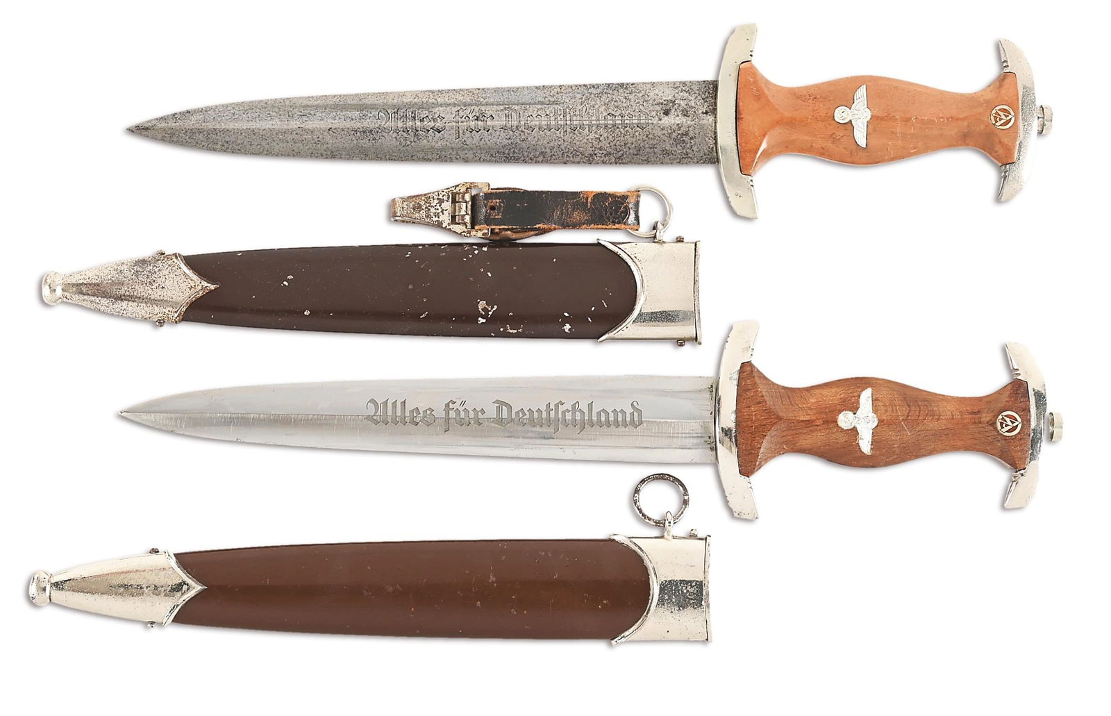 LOT OF 2: THIRD REICH SA DAGGERS.: Lot consists of: (A) Third Reich SA dagger with "JUSTINUSWERK SOLINGEN" marked nickel-plated steel blade with runner and scattered marks, and freckling. The acid-etched "Alles fur Deutschland" motto i