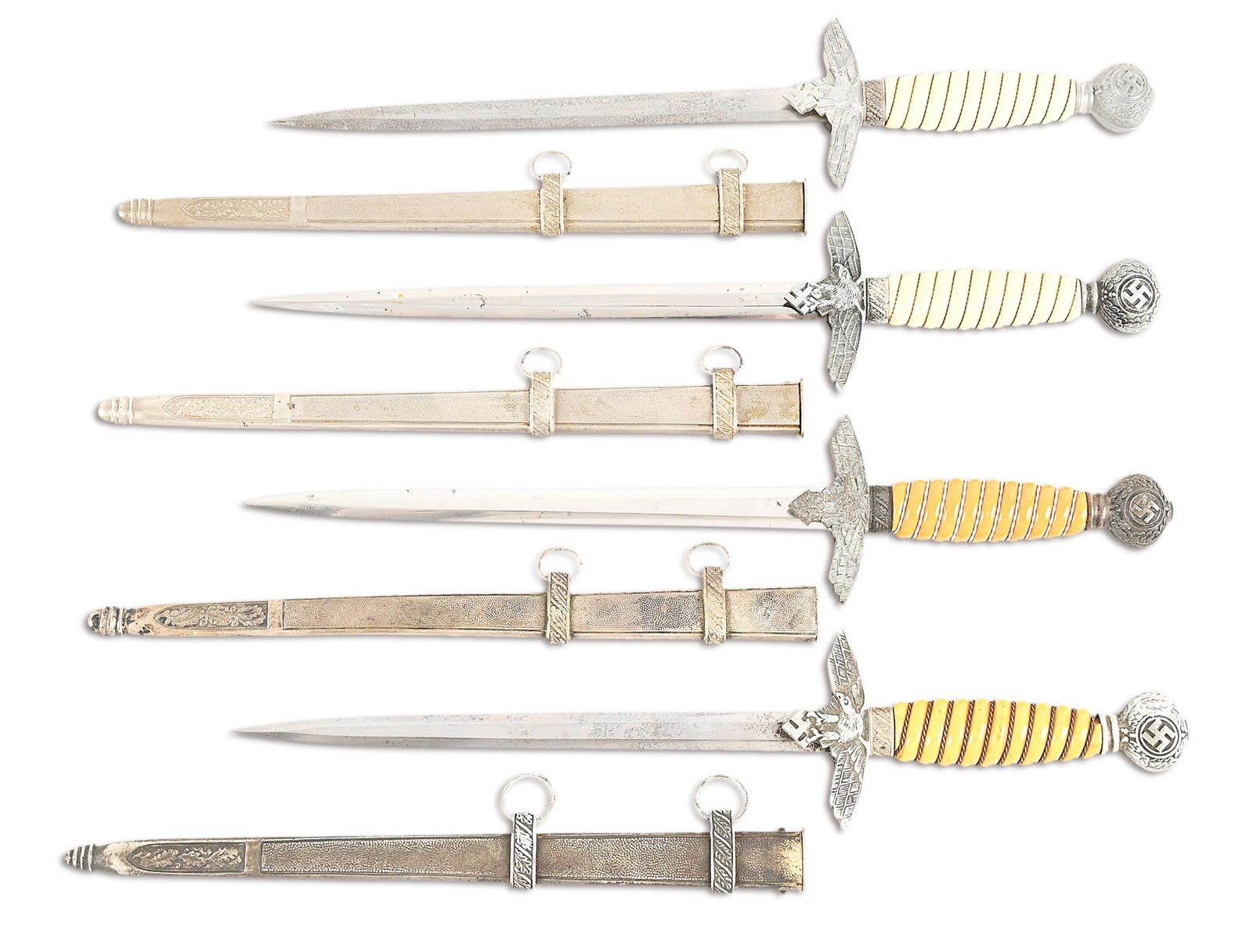 LOT OF 4: THIRD REICH LUFTWAFFE DAGGERS.: Lot consists of: (A) Luftwaffe 2nd Model dagger with unmarked nickel-plated steel blade. Blade exhibits a gray patina with freckling. Aluminum cross-guard and pommel exhibit a light patina. The wire-w