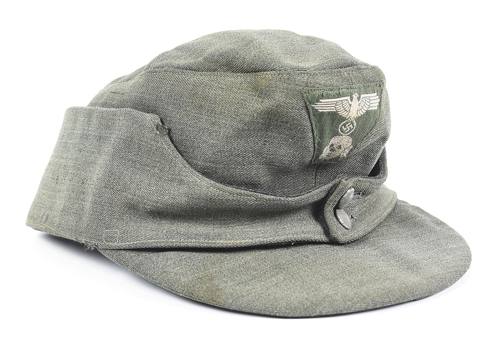 GERMAN WWII WAFFEN SS FIELDGRAY M43 CAP.: German World War II Waffen SS Feldgrau M43 cap. Worn cap made from a fine Feldgrau wool exhibits light staining and approximately a dozen quarter inch areas of damage on its exterior. Twill pull downs