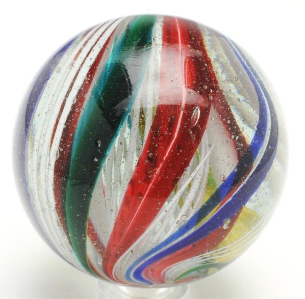 Large 3-Stage Latticino Swirl Marbles.: White latticino surrounded by bands of red underlined in white. Outer bands consist of cobalt bands underlined in white and green bands underlined in yellow. In between the cobalt and green bands are