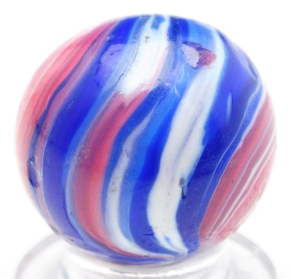 Uncased Onionskin Marble.: Transparent clear glass with 360° Indian style banding in red, white, and blue. One minor chip. Condition (8.9). Size 11/16"" Dia."