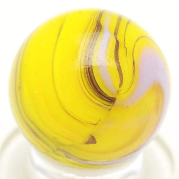 Christensen Agate Striped Opaque Marble.: Yellow base with purple and black striping. Transparent clear in abundant in marble and shows a 3-D effect. Condition (9.7). Size 5/8"" Dia."