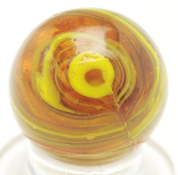 Christensen Agate Submarine Marble.: Light amber base with electric yellow striping. Nice submarine effect with two pinch lines. One as-made cold roll mark. Condition (9.4). Size 5/8"" Dia."