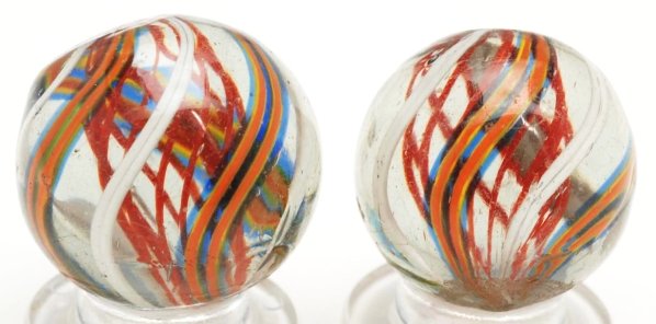 Lot of 2: Same Cane Red Latticino Swirl Marbles.: Red latticino cores with outer bands alternating in white, translucent blue, orange, and yellow. Beautiful set of marbles from the same cane. Condition (9.4 - 9.6). Size Each: 3/4"" Dia."