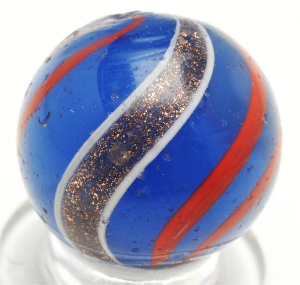 Blue Opalescent Banded Lutz Marble.: Dark blue lutz with red lines. This marble surface has tiny pitting and minor chipping. Condition (8.7). Size 11/16"" Dia."