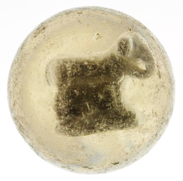 Large Elephant Donut Hole Sulphide Marble.: Standing elephant with donut hole formed from the elephant's trunk and touching body. Great detail and well-centered figure. Surface shows wear and minor flea bites. Condition (8.75). Size 2 - 1/8"" D