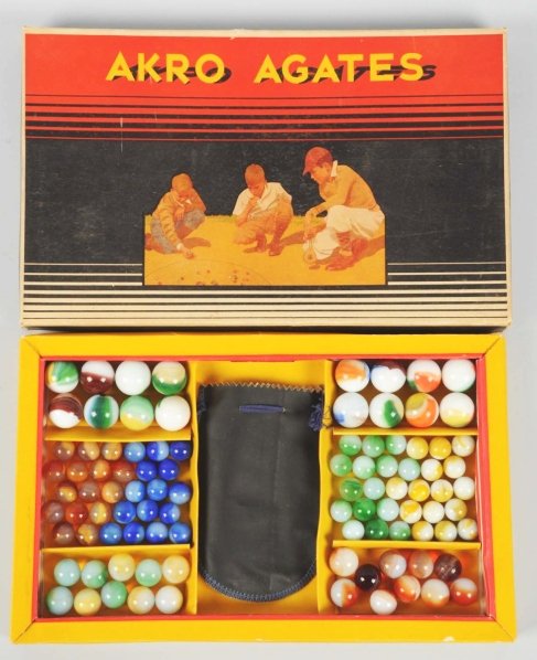 Akro Agate No. 300 Marble Box Set.: This box set contains 60 translucent and opaque patch marbles, 20 translucent and opaque patch marbles, and 16 larger patch marbles that includes four oxblood patches. Includes original box. Condition