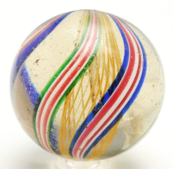 Yellow Latticino Swirl Marble.: Yellow latticino with outer decorations in red, white, and blue bands alternating with green, red, and white bands. This marble has internal as-made subsurface debris and surface reflections. Conditio