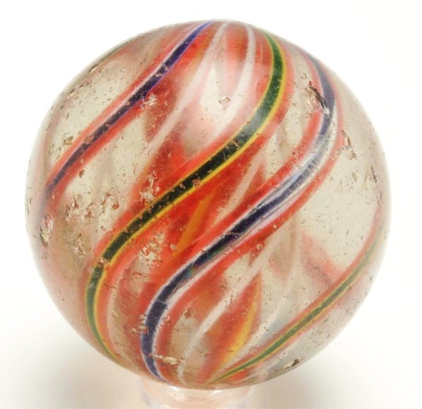 Large 3-Stage Swirl Marble.: Three stage swirl consisting of yellow and red bands surrounded by white latticino. Outer decoration consisting of translucent red, yellow, and green alternating with translucent red, white, and blue.