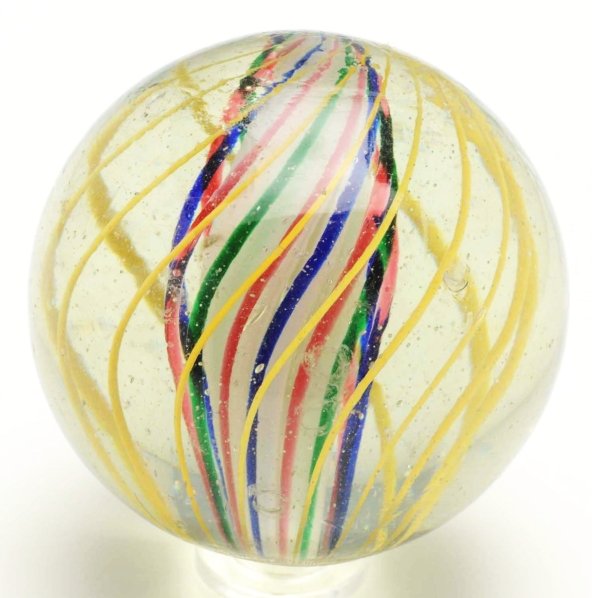 Large 3-Stage Solid Core Swirl Marble.: White solid core surrounded by alternating green, pink, and blue bands. Outer decoration consists of evenly spaced birdcage yellow latticino. This marble has one minor flea bite and several micro subs
