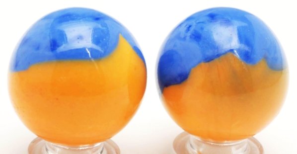 Lot of 2: Akro Agate Experimental Patch Marbles.: Both with orange bases and royal blue patches. These marbles are extremely hard to find, especially in this condition. One marble has an as-made raised area to surface. Condition (9.4 - 9.6). Size Eac