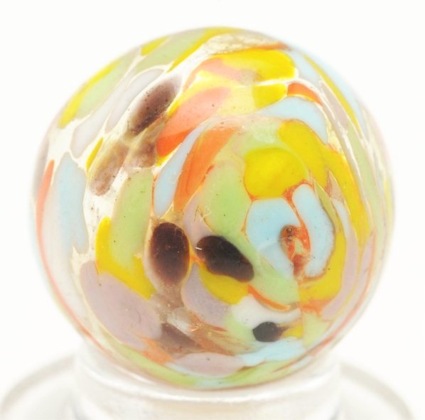 Christensen Agate Cyclone Guinea Marble.: Clear base with single pinch line. Nice submarine effect on inside. One shallow surface chip. Condition (8.9). Size 5/8"" Dia."