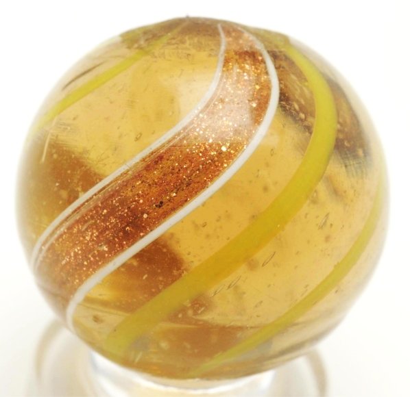 Amber Glass Banded Lutz Marble.: Medium amber translucent base with yellow lines. Yellow lines have a slight green tint due to being under the amber surface glass. This marble is in great condition with just one micro flea bite. Cond