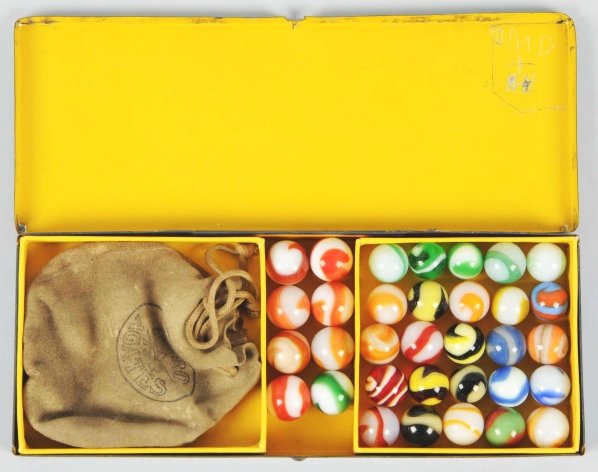 Akro Agates No. 150 Tin Marble Set.: Box contains 25 corkscrew marbles in multiple colors and six larger-sized corkscrews. Also includes one Akro Agate bag. Box top has some paint fading and corner wear. Inner lid has the initials ""DMD"