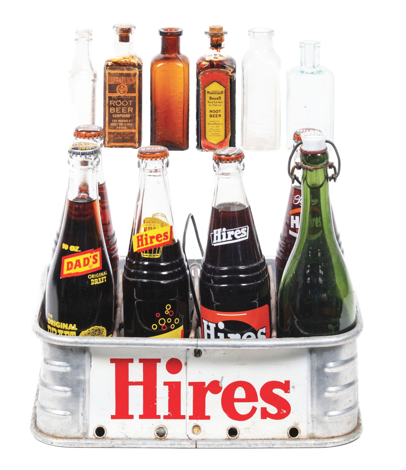 METAL HIRES CRATE OF ASSORTED SODA AND SYRUP BOTTLES.: A nice collection of syrup bottles and Hires Root Beer metal crate with various bottle examples. The items in this collection range from the 1910's through the 1960's. CONDITION: The metal crate is a