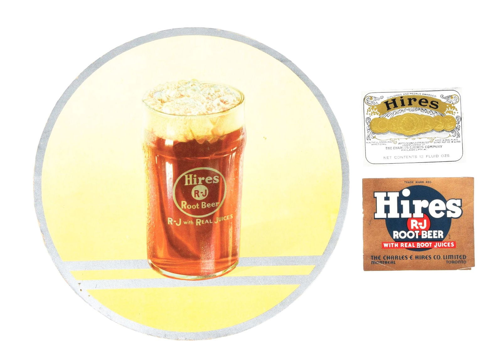 COLLECTION OF 3 HIRES ROOT BEER PAPER ADVERTISING ITEMS: A nice collection of 3 paper advertising items from Hires Root Beer, including a circular cardboard element and two paper bottle labels. CONDITION: The cardboard element shows light fading throughout