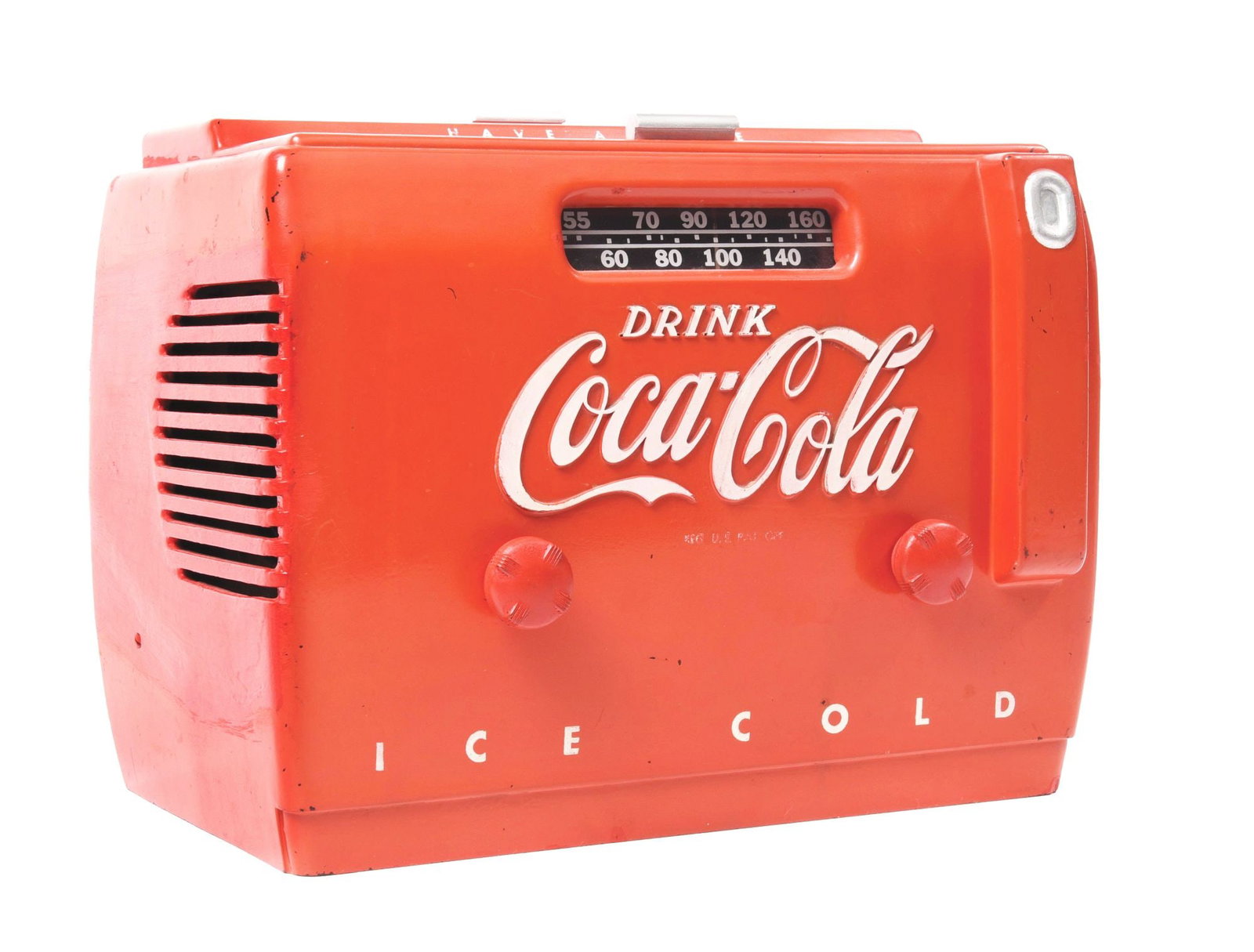 DRINK COCA-COLA ICE COLD RADIO: A c. 1950s "Drink Coca-Cola Ice Cold" radio complete with the original electric. CONDITION: The radio has fade throughout with areas of surface staining, as well as scratches with paint loss, mostly c