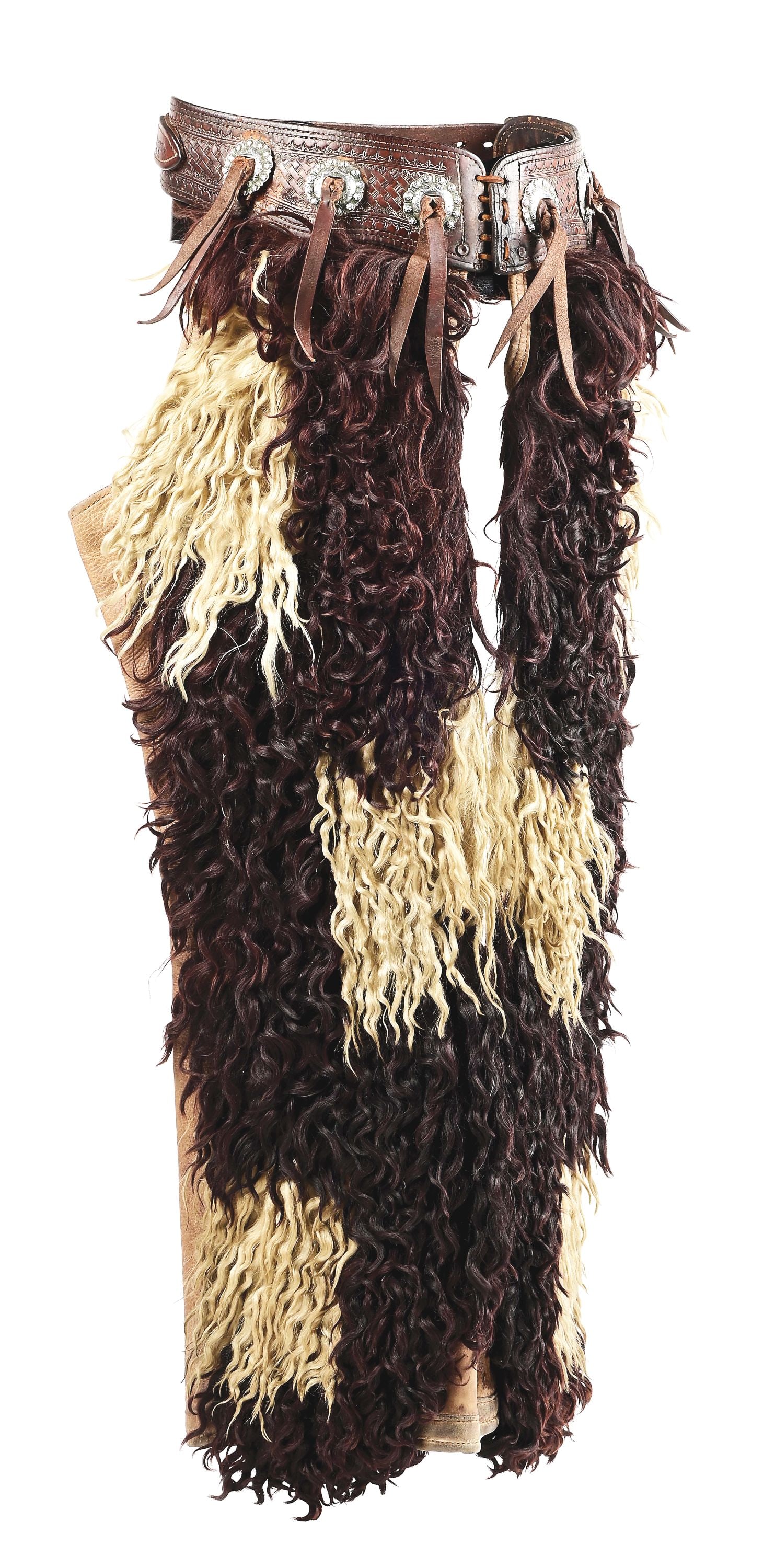 HAMLEY BLACK & WHITE PINTO CHAPS: Canvas lined, leather backed, black and white Pendleton, Oregon 38" long angora chaps with pockets and basket stamped billet with six slotted, scalloped silver conchos with raised berry design and lat