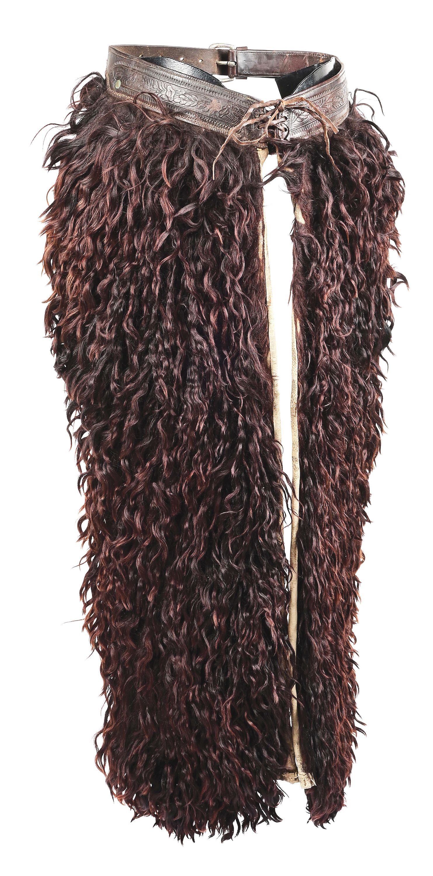 G. S. GARCIA WOOLIE CHAPS: A pair of brown angora chaps shown in the 1924 catalog as No. 1 "Chapareras", floral belt as shown. Marked on the end of the belt "G. S. Garcia / Elko, NV". Good lush hair, canvas back with one repair