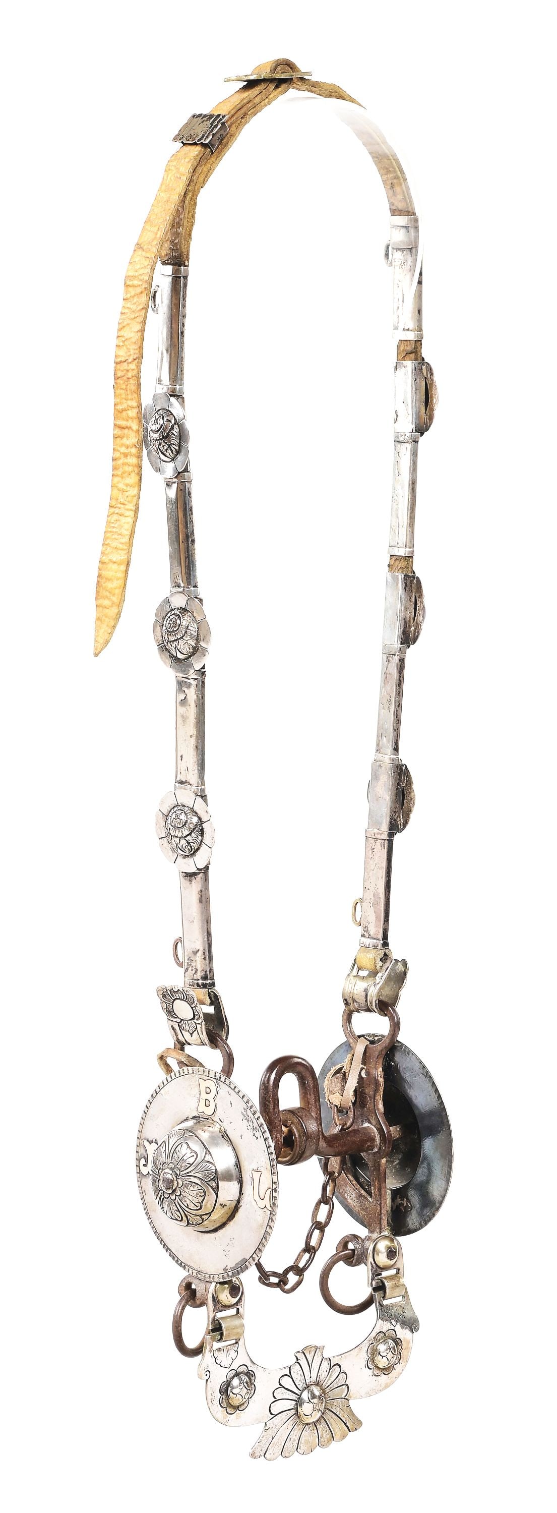 ARGENTINA SILVER BRIDLE WITH LARGE COPA BIT: Argentina circa 1890s silver bridle with traditional Copa bit. Pure silver was used in its construction. The bit features a large floral slobber bar on single rollers, the sides are decorated with 3 (