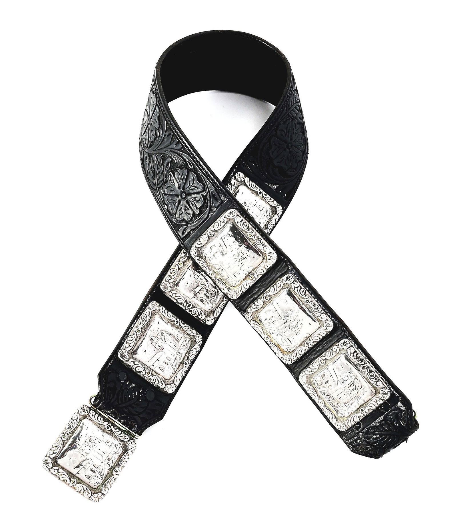 EDWARD H. BOHLIN MISSION-THEMED CONCHO BELT: Unusual "Bohlin / Hollywood" marked 36" long black floral carved belt measuring 2 3/8" wide and mounted with six, 2" square California Mission-themed conchos patterned after Bohlin's renowned Mission 