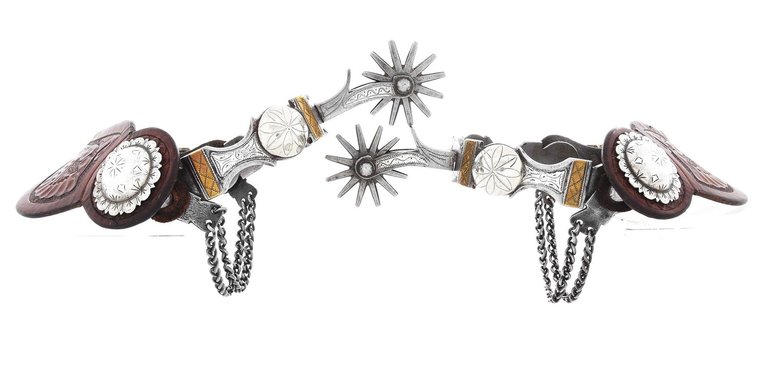 CARLOS FIGUEROA, LOS ANGELES, CALIFORNIA SPURS: Multi-metal, double-mounted, silver, brass and nickel Southern California spurs with 12-point rowels, vaquero heel chains, and two-piece leathers adorned with large domed and scalloped Visalia style e
