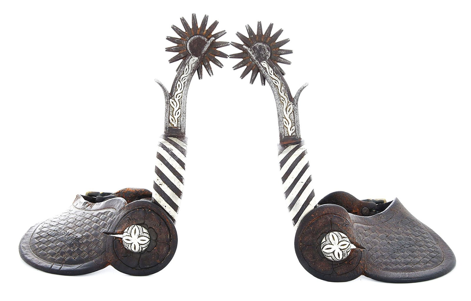 CARL ERICKSON, CANON CITY, COLORADO PRISON SPURS: Stamped with Erickson inmate No "9781" on the very top of the silver inlaid vine and leaf pattern birds head shanks, these rare maker-marked Colorado Penitentiary spurs have striped heel bands, 16-poi