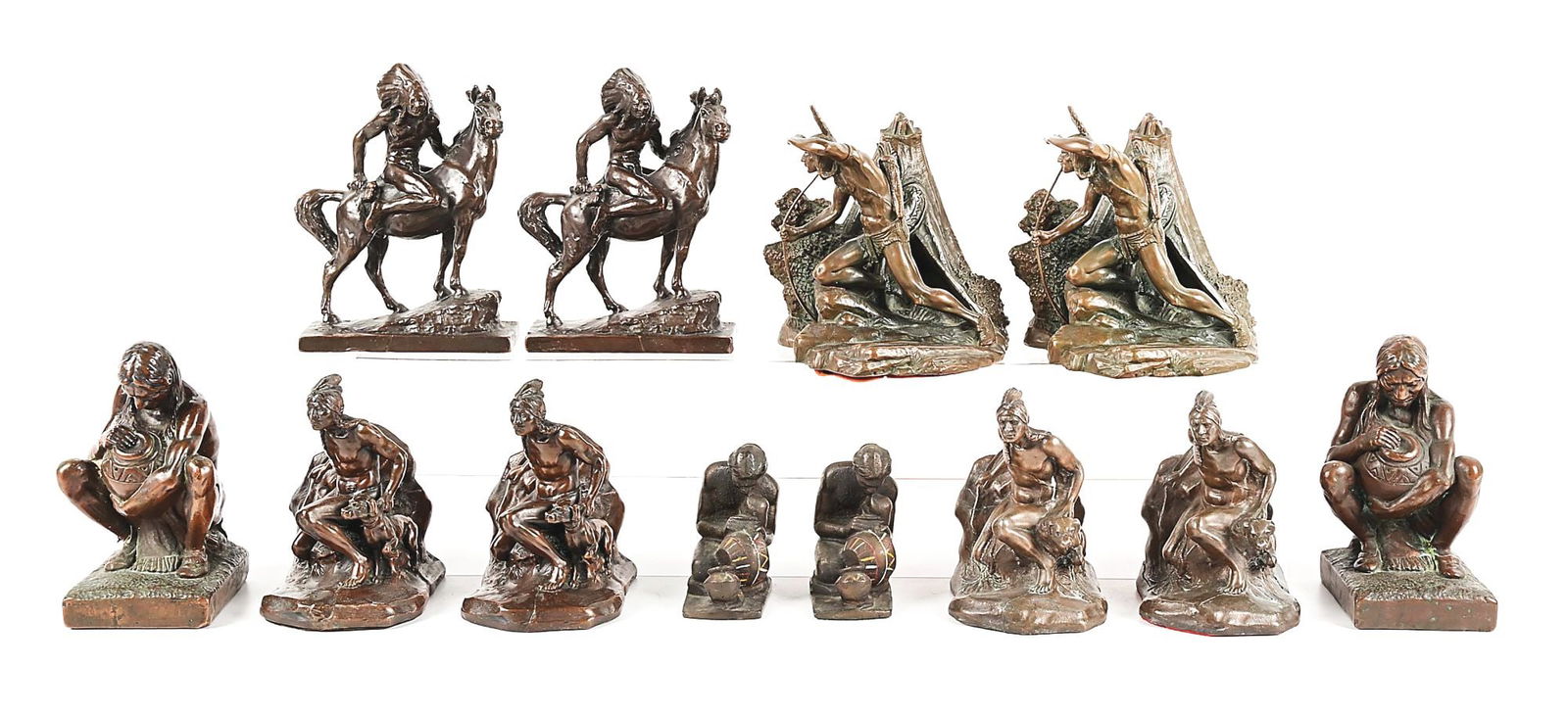 LOT OF 6 CAST NATIVE AMERICAN FIGURATIVE BOOKENDS: A nice grouping of six sets of Indian themed vintage bookends including an 8" x 7" Archer/Scout, an unmarked Hertzel "Mounted Chief", and a scarce squatting Native with pot (damaged leg). Varying size