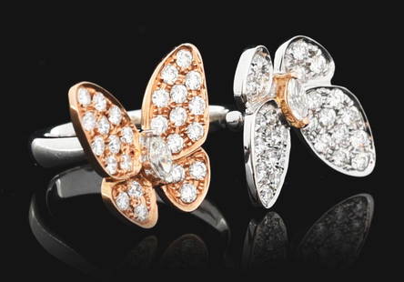 18K GOLD TWO-TONE DIAMOND BUTTERFLY RING, AFTER VAN CLEEF & ARPELS: Style of Van Cleef & Arpels, 18k white and rose gold two-tone butterfly "Between-The-Finger" diamond ring consisting of 54 mixed round brilliant cut and marquise cut natural diamonds with a combined t