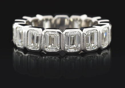 LADIES' PLATINUM 5CT EMERALD CUT DIAMOND ETERNITY BAND: Ladies' platinum and diamond eternity band consisting of 15 bezel-set emerald cut natural diamonds with a total weight of 5.00cts, graded H/I color, VS clarity. Finger size 6 1/4. Width 5.5mm. Gross