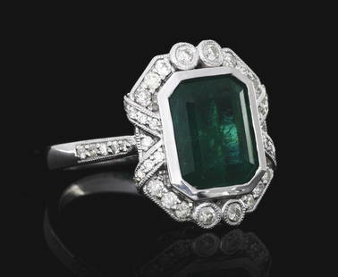 LADIES' PLATINUM EMERALD & DIAMOND RING W/ GIA REPORT: Ladies' platinum emerald and diamond ring consisting of 1 octagonal step-cut emerald weighing 5.36cts and 44 round brilliant cut natural diamonds with a total weight of 0.51cts. Finger size 6-1/2. Wid