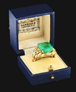 LADIES' 14K GOLD 7CT EMERALD AND YELLOW DIAMOND RING.: Ladies' 14k yellow gold emerald and diamond ring consisting of 1 emerald cut natural emerald measuring approximately 13.5 x 12.2 x 6.4mm with an estimated weight of 7.00cts, and 26 mixed marquise and