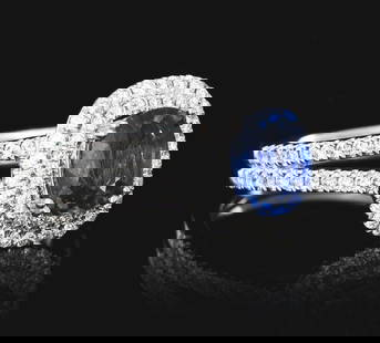 LADIES' PLATINUM SAPPHIRE & DIAMOND RING W/GIA REPORT: Ladies' platinum sapphire and diamond ring consisting of 1 oval cut blue sapphire weighing 1.42cts and 94 round brilliant cut natural diamonds with a total weight of 0.51cts. Finger size 6-1/2. Width