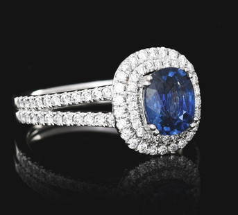 LADIES' PLATINUM SAPPHIRE & DIAMOND RING W/GIA REPORT: Ladies' platinum sapphire and diamond ring consisting of 1 oval cut blue sapphire weighing 1.42cts and 94 round brilliant cut natural diamonds with a total weight of 0.51cts. Finger size 6-1/2. Width