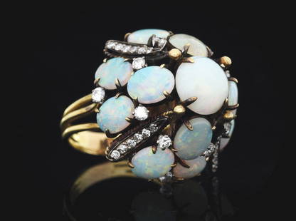 18K YELLOW GOLD VINTAGE OPAL AND DIAMOND RING: Ladies' vintage 18k yellow gold opal and diamond cocktail ring set with 13 cabochon natural white opals, largest measuring 10mm in diameter, and 36 round cut diamonds with a total weight of 1.00cts.