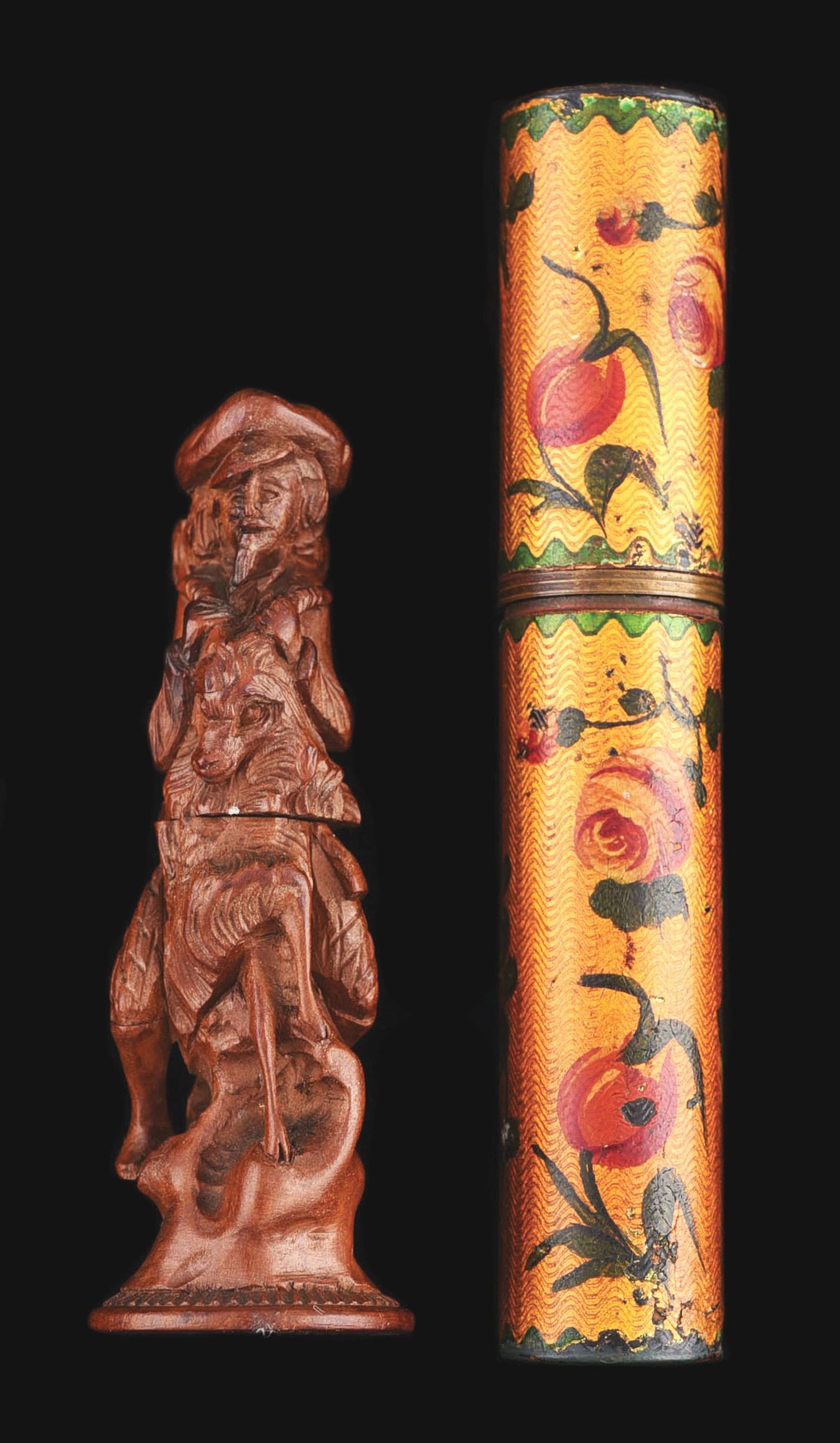 LOT OF 2: VICTORIAN ANTIQUE FIGURAL NEEDLE CASES: (A) Hand-painted with tortoise interior. 4 - 3/4" long. (B) Hand-carved wooden needle case of hunter holding horned animal. Exquisite carving. No damage or repairs. Condition: (Excellent) Dimensions: