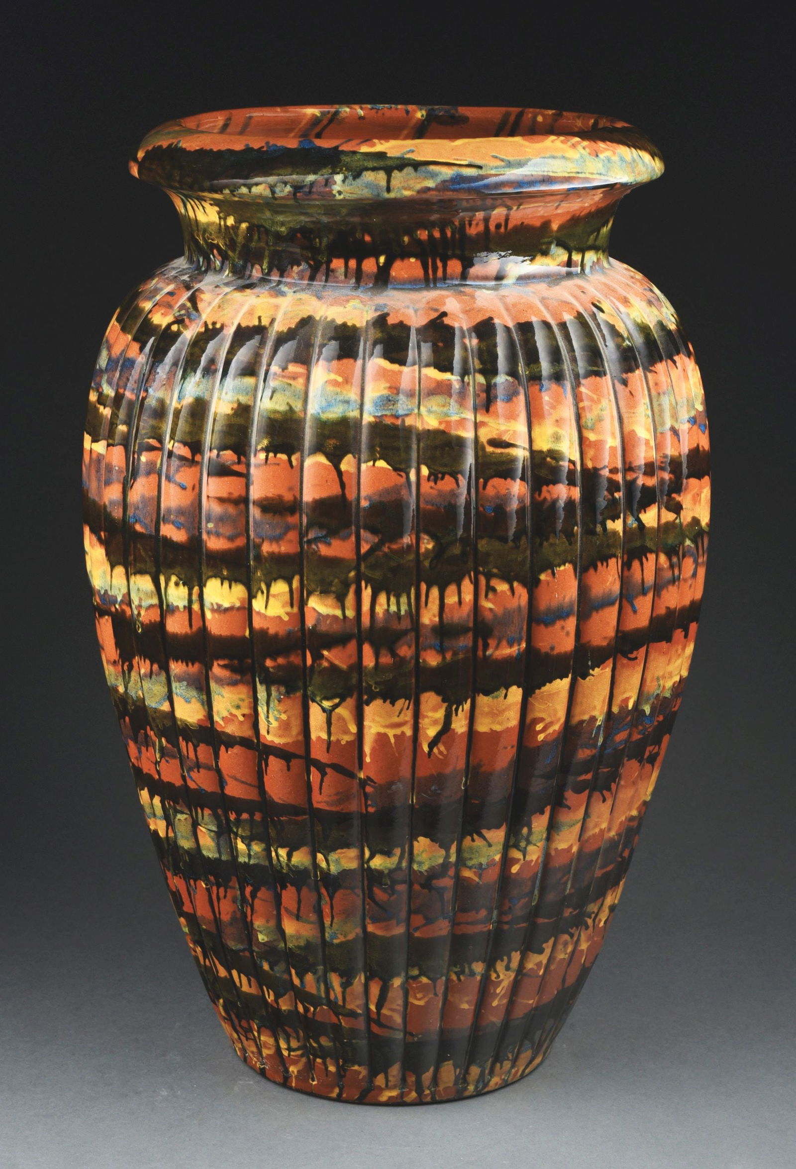 MONUMENTAL GLAZED EARTHENWARE FLOOR VASE: Marbleized multicolored glazes on a ribbed body. Condition: (Mint) Dimensions: