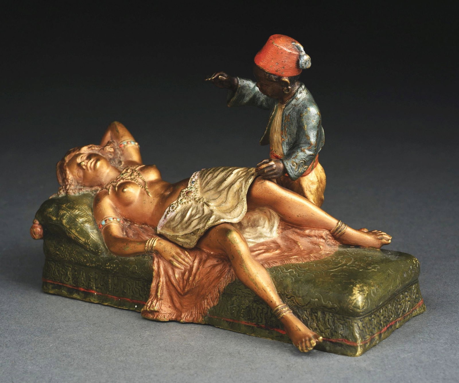 BRONZE EROTICA NUDE WOMAN ON COUCH: Dress lifts to expose nude woman. No damage or repairs. Condition: (Excellent) Dimensions: 5 - 3/4" x 2 - 1/4" x 4".