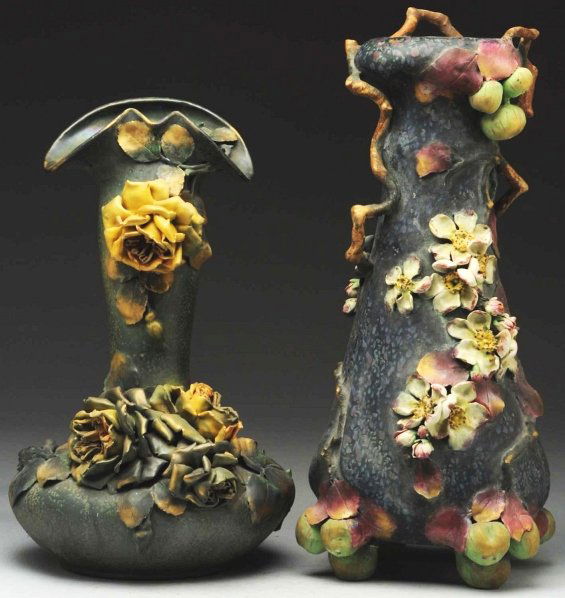 Lot of 2: Amphora Ceramic Vases.: Includes one with applied roses and leaves. Minor losses to the rose petals. Stamped with Amphora oval mark, Amphora crown, and "Austria" on underside. Also includes one large vase on raised base of f