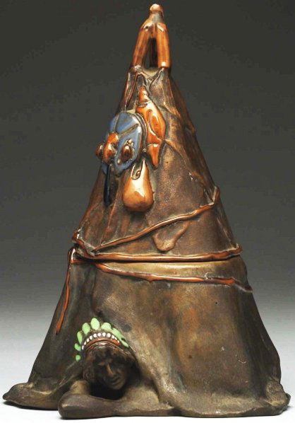 Amphora Ceramic Humidor.: Humidor in the shape of a teepee with Indian looking out of teepee. Figural Indian at base. Impressed Amphora marks on underside. Condition (Mint). Size 7 - 1/4" T.