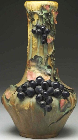 Amphora Ceramic Vase with Applied Grapes.: With applied grapes and leaves. Amphora crown and oval marks on underside. Condition (Very Good). Size 14 - 1/2" T.
