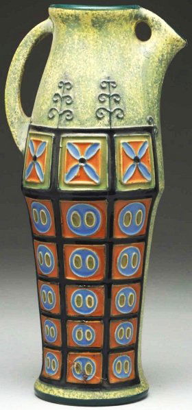 Czech Amphora Pitcher.: With raised stylized decoration on each side. Underside with Czech Amphora mark. Condition (Mint). Size 14" T.