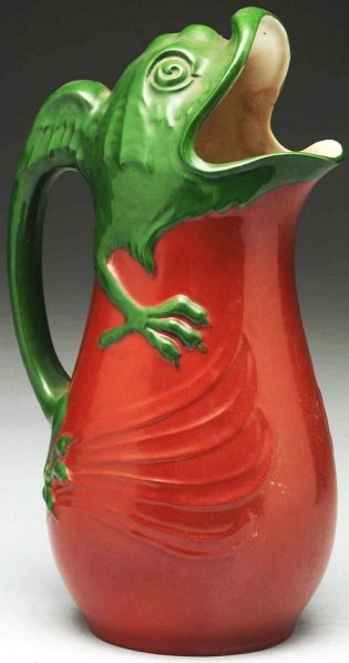Rorstrand Pottery Pitcher.: Circa 1900. Made in Sweden. With stylized Art Nouveau monster as handle and mouth of pitcher. Rorstrand mark on bottom. Condition (Mint). Size 10 - 1/4" T.
