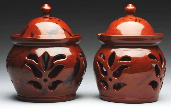 Pair of Lester Breininger Covered Bowls.: With unusual floral cutouts. Possibly can holders. One rim chip to one of the pieces. Condition (Excellent). Size Each: 8" T.