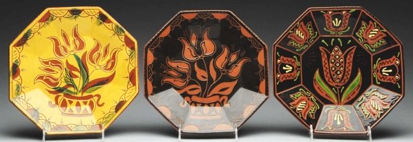 Lot of 3: Lester Breininger Octagonal Plates.: Includes one with slipware decoration of tulips and urn, another with tulips and an urn, and one with vibrant and large tulips. Condition (Excellent). Size Each: 10 - 3/4" x 10 - 3/4".