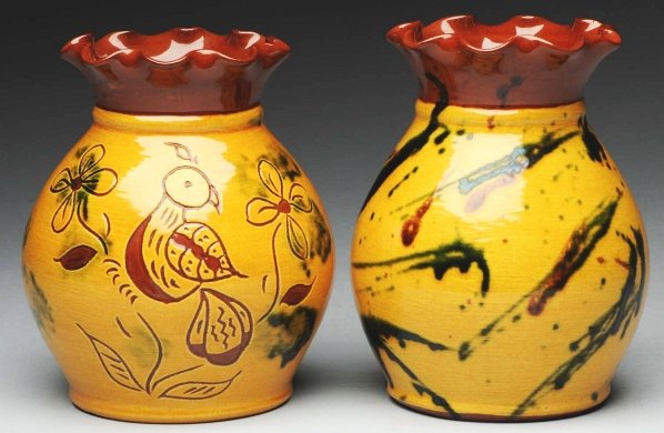 Pair of Lester Breininger Pottery Vases.: With ruffled edges. One retains an incised bird decoration and the other with glaze in greens, browns, and yellows. Condition (Excellent). Size Each: 6" T.