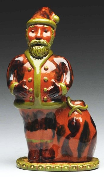 Lester Breininger Santa Claus Redware Bank.: Attached to an incised green floral base. Condition (Excellent). Size 10" T.