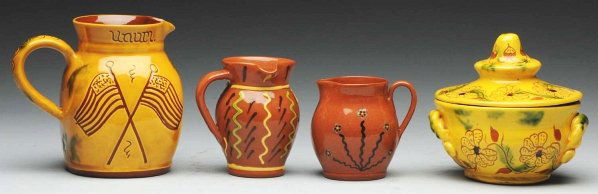 Lot of 4: Lester Breininger Pieces.: Includes one very early redware sugar bowl, two small pitchers with slipware decoration, and one patriotic pitcher retaining an incised eagle and flags. Condition (Mint). Size Largest: 5 - 1/2" T.