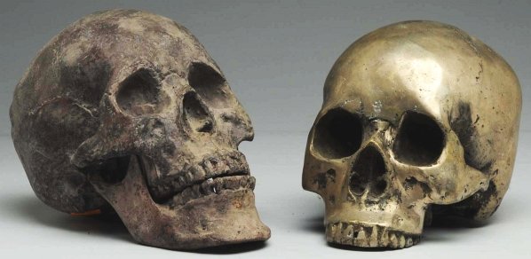 Lot of 2: Metallic Skulls.: One has separate lower jaw. One is polished silver and other is oxidized copper. Both anatomically correct. Circa 1920. Condition (Excellent). Size Each: 5 - 1/4" T.